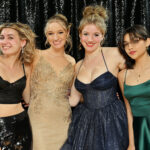 group of girls posing at the photo booth