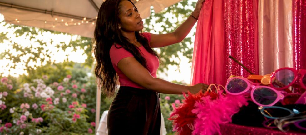 Event planner setting up prom photo booth