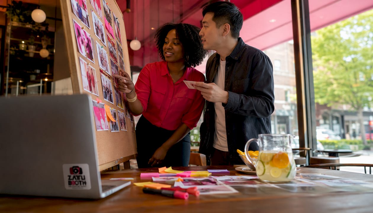 Two planners collaborating on photo booth gallery sequence