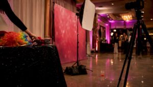 Photo booth with props and lighting at prom