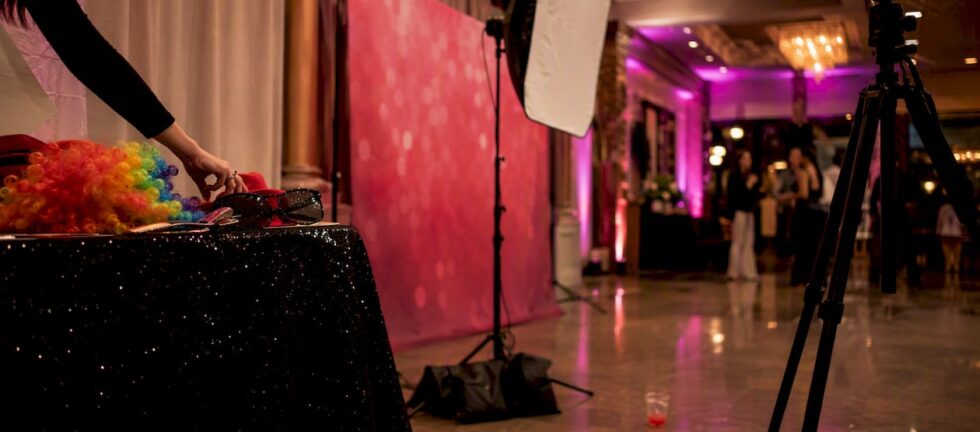 Photo booth with props and lighting at prom